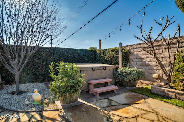 view of patio / terrace featuring a hot tub