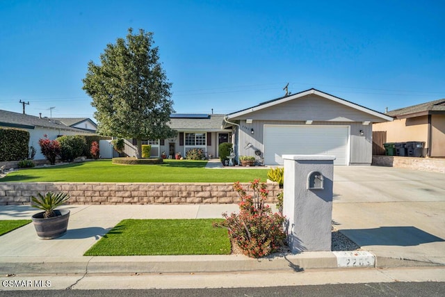 single story home with a garage, a front yard, and solar panels