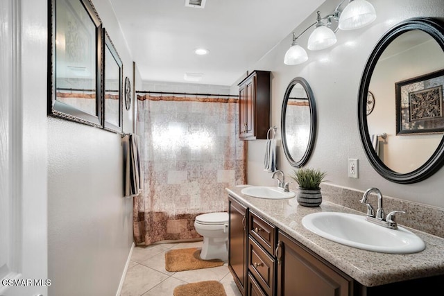 full bathroom featuring tile patterned flooring, vanity, shower / bath combo, and toilet