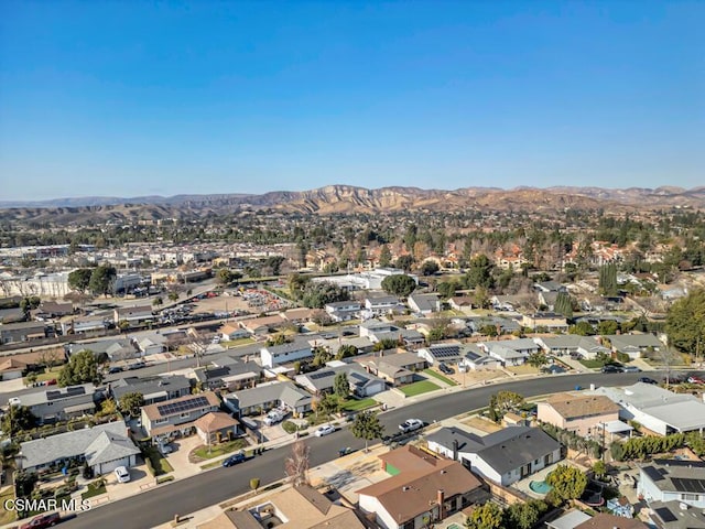 birds eye view of property with a mountain view