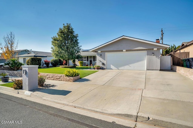 single story home with a garage and a front yard