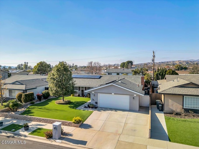 ranch-style home with a garage and a front yard