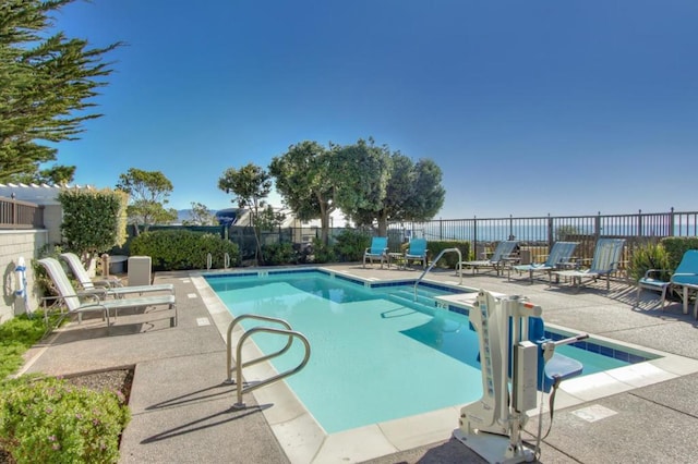 view of swimming pool featuring a patio