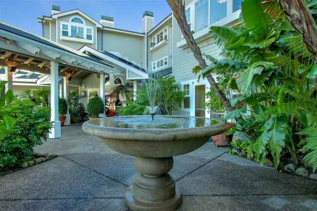 view of property's community featuring a patio