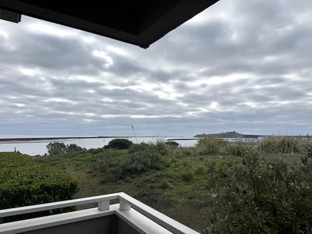 balcony featuring a water view