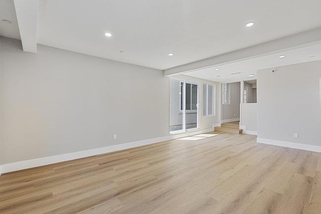 unfurnished living room featuring light wood-type flooring