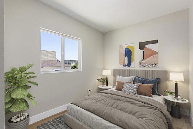 bedroom with hardwood / wood-style flooring