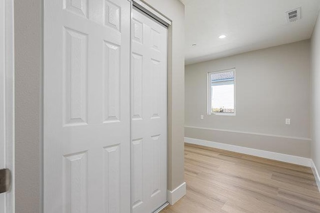 hallway featuring light wood-type flooring