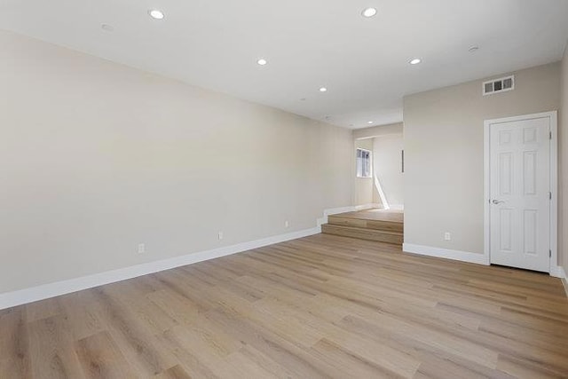 spare room with light hardwood / wood-style floors