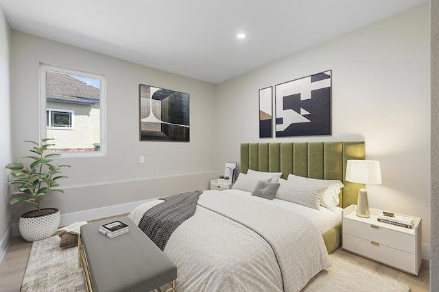 bedroom with light hardwood / wood-style floors