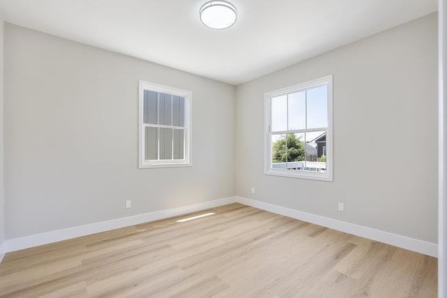 spare room featuring light hardwood / wood-style flooring