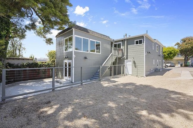 back of property with a patio