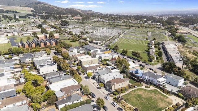 birds eye view of property featuring a mountain view