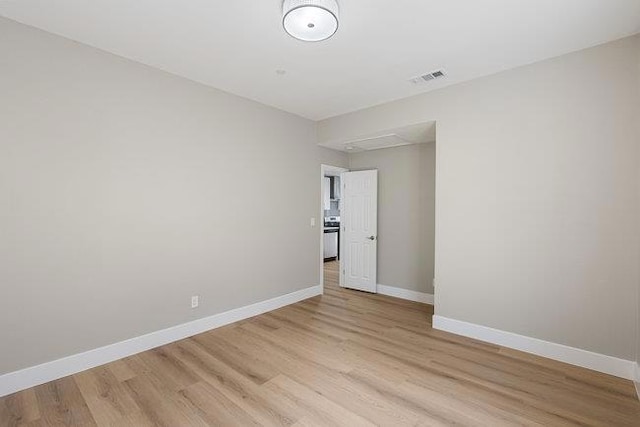 spare room with light hardwood / wood-style floors