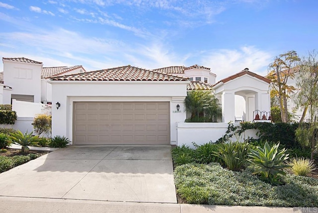 mediterranean / spanish-style house featuring a garage