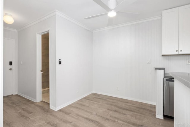 unfurnished room with ornamental molding, ceiling fan, and light wood-type flooring