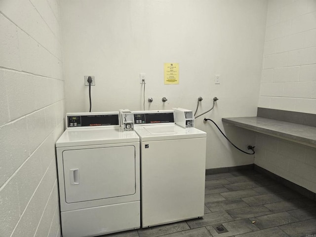 laundry area with washing machine and clothes dryer