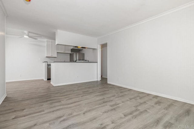 unfurnished living room with crown molding, light hardwood / wood-style floors, and ceiling fan