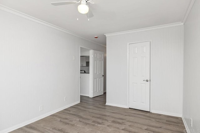 unfurnished bedroom featuring ceiling fan, ornamental molding, and hardwood / wood-style floors