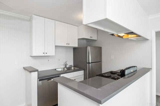 kitchen with sink, appliances with stainless steel finishes, white cabinetry, custom exhaust hood, and kitchen peninsula