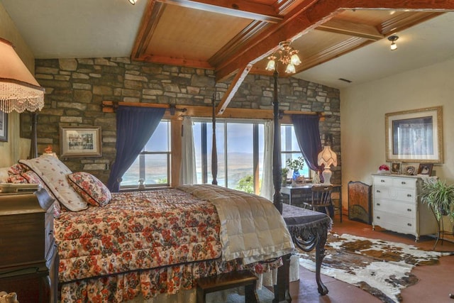 bedroom featuring vaulted ceiling with beams