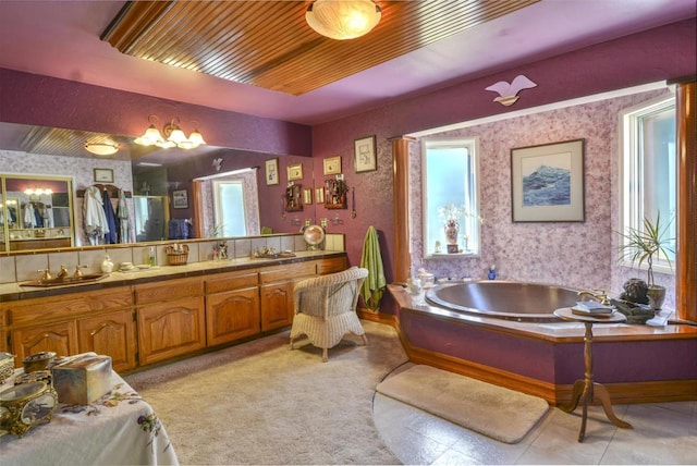 bathroom featuring vanity and a washtub