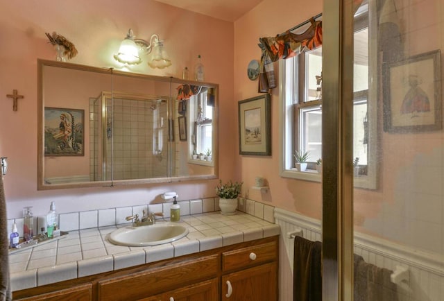 bathroom with vanity and an enclosed shower