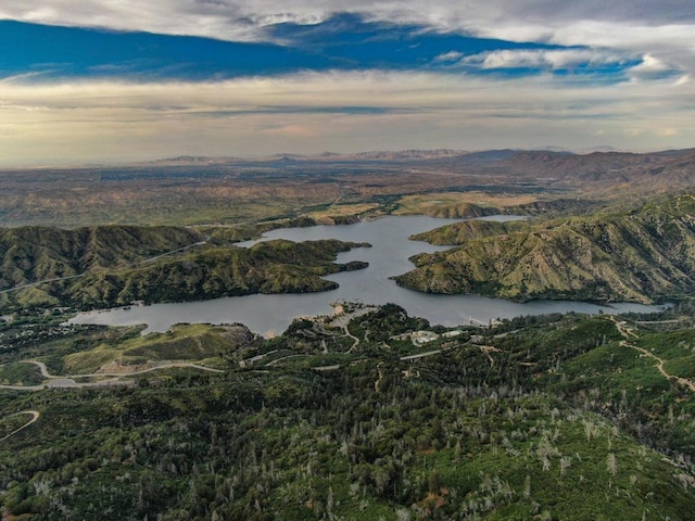 aerial view at dusk with a water and mountain view