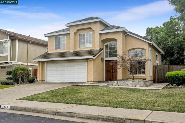 view of front of property with a garage and a front lawn