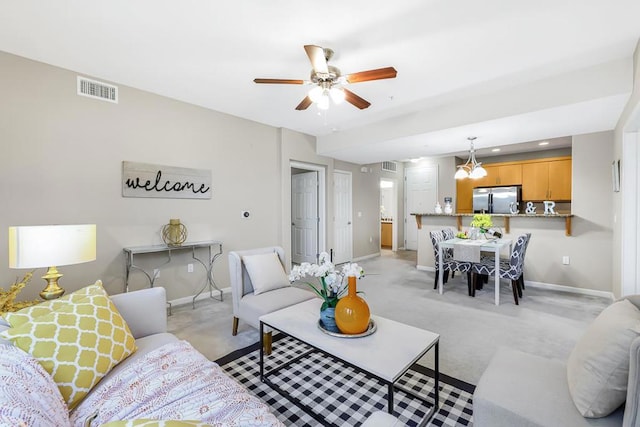 living room with light colored carpet and ceiling fan