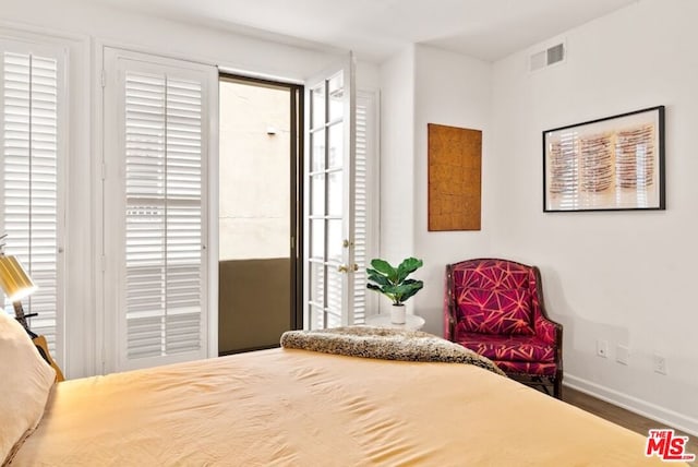 bedroom featuring multiple windows