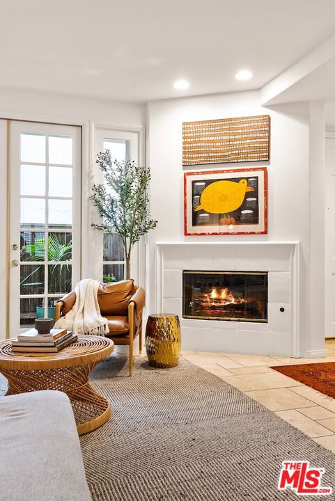 living area with tile patterned flooring