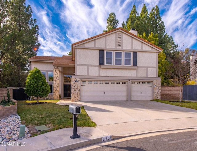 view of front facade featuring a garage and a front yard