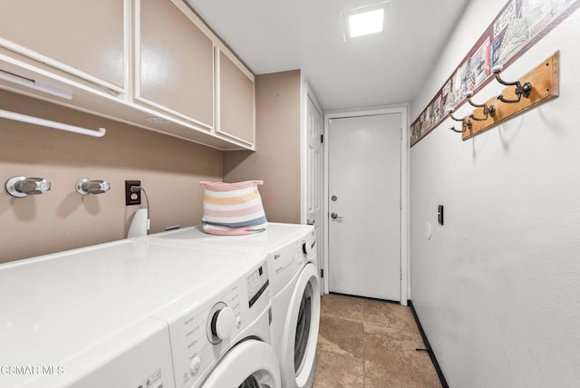 laundry area featuring cabinets and washing machine and clothes dryer