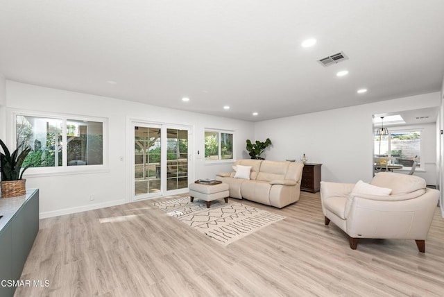 living room with light hardwood / wood-style floors