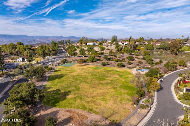 birds eye view of property featuring a mountain view