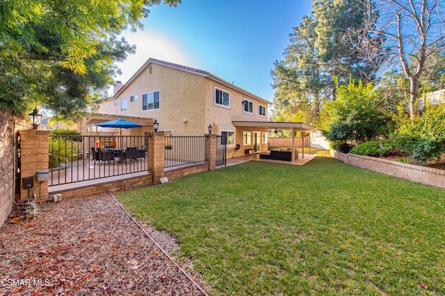 rear view of house with outdoor lounge area, a patio area, and a lawn