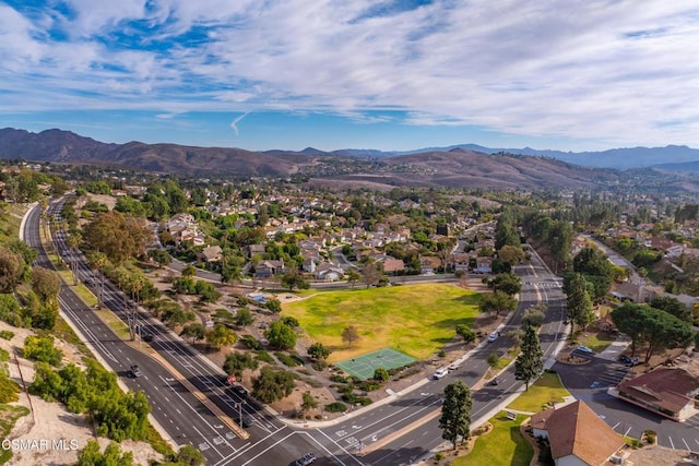 birds eye view of property featuring a mountain view