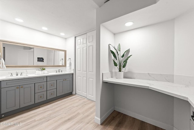 bathroom featuring vanity and hardwood / wood-style floors