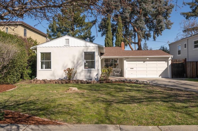 view of front facade with a garage and a front yard