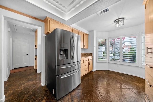 kitchen featuring baseboards, visible vents, stainless steel refrigerator with ice dispenser, and light brown cabinets