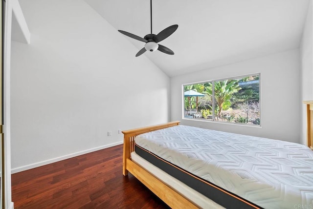 bedroom with lofted ceiling, ceiling fan, baseboards, and wood finished floors