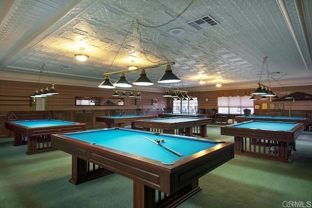 game room with an ornate ceiling, visible vents, carpet flooring, wooden walls, and billiards