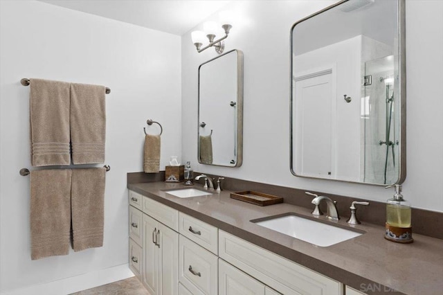 bathroom with a shower with door and vanity