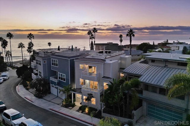 aerial view at dusk with a water view