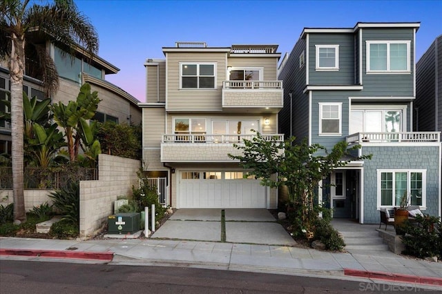 multi unit property featuring cooling unit, a garage, and a balcony