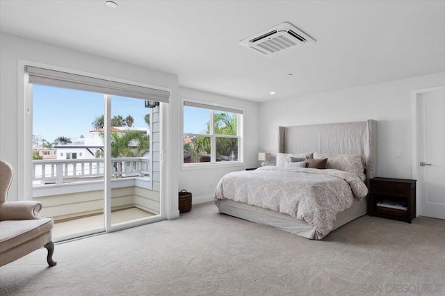 bedroom featuring carpet flooring and access to outside