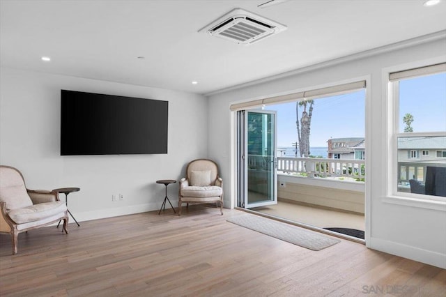 living area featuring light hardwood / wood-style floors