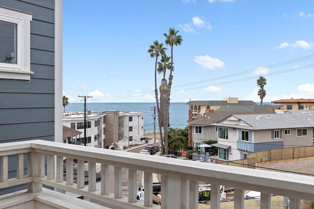 balcony featuring a water view