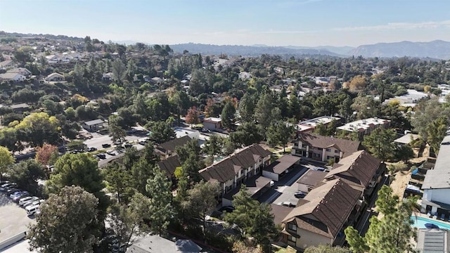 birds eye view of property with a mountain view